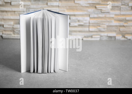 Open book on gray table Stock Photo