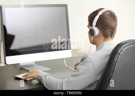 Teenager playing computer game at home Stock Photo