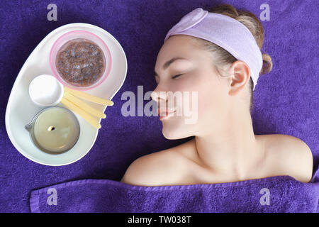 Young woman having facial care at spa salon Stock Photo
