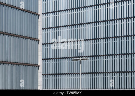 Modern office building with vertical shutters to screen the sun Stock Photo