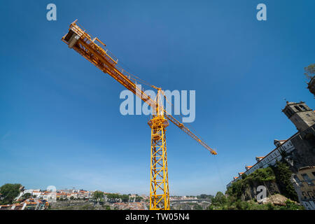 Tower crane against a blue sky Stock Photo