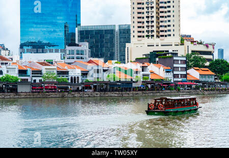 BANGKOK, THAILAND-MAY 19, 2019 : Tourist travel by boat to watching waterfront building and culture. Tour package background. Sailing boat at Bangkok, Stock Photo