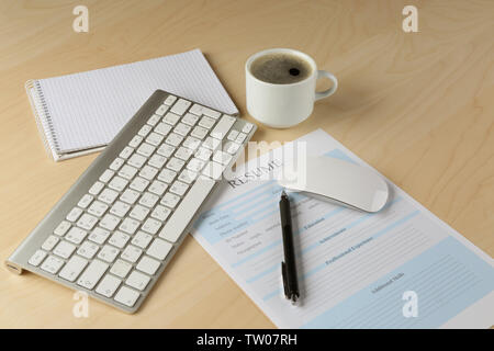 Cup of coffee and resume form on - Resume Form Keyboard And Cup Of Coffee On Wooden Table Closeup Tw07rh 