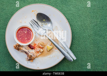 Top view of empty plate, dirty after the meal is finished on tablet with copy space Stock Photo