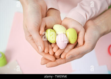 Mother and daughter holding decorated Easter eggs Stock Photo