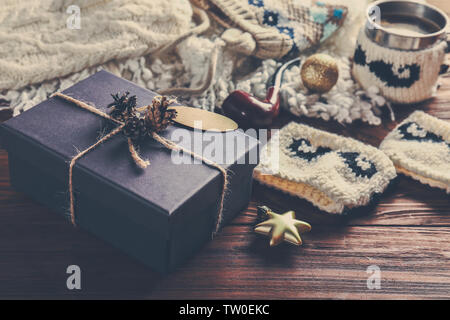Gift box and Christmas decorations on wooden background Stock Photo