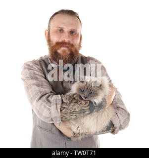 Colorpoint cat with bow tie sitting on black table in living room