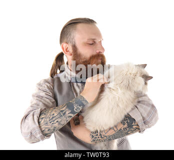 Colorpoint cat with bow tie sitting on black table in living room