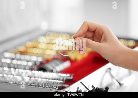 Doctor hand holding trial lens Stock Photo