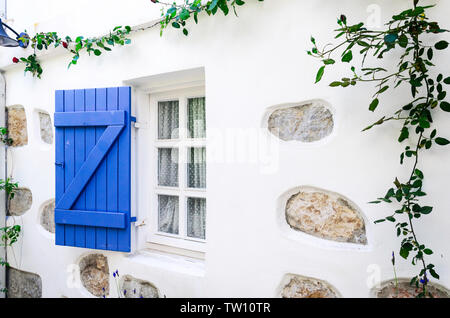Beautiful vintage window with open blue shutters Stock Photo