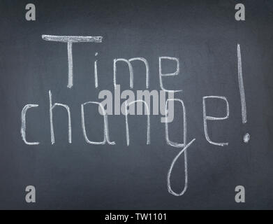 Phrase TIME CHANGE on blackboard Stock Photo