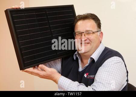 Ben Harrison, managing partner of mypower, the solar panel installation company, based at Toddington, Gloucestershire, England, UK, pictured with a sm Stock Photo