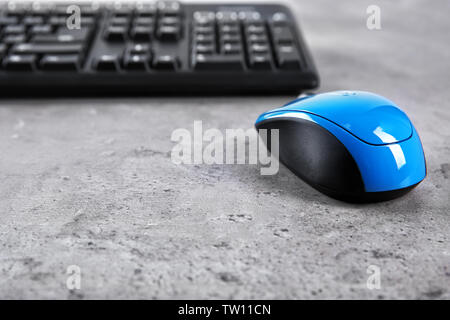Optical mouse and computer keyboard on table Stock Photo