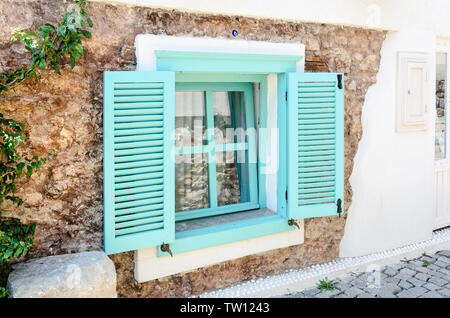 Beautiful vintage window with open green shutters Stock Photo