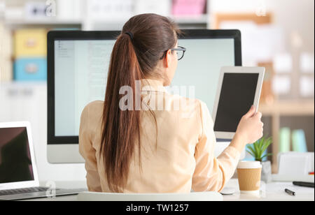 Woman programmer working at office Stock Photo