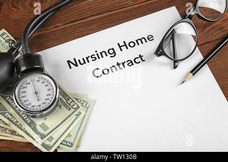Nursing Home Contract on clipboard, closeup. Medical concept Stock Photo