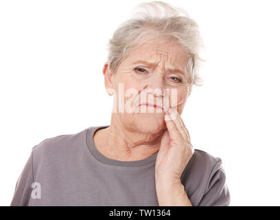 Elderly woman suffering from toothache on white background Stock Photo