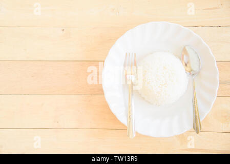 scoop rice to dish / pour the rice from mold to dish Stock Photo