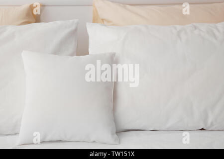 Blank soft pillows on the bed Stock Photo