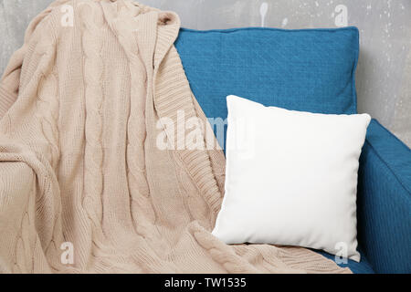 Blank soft pillow on cozy armchair Stock Photo