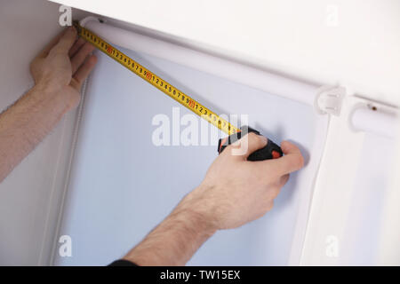 Male hands making window measurements Stock Photo
