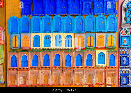 Souvenirs and gifts on the streets of Chefchaouen. Beautiful magnets on the streets of Morocco. Morocco, Chefchaouen April 24, 2019 Stock Photo