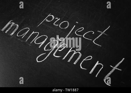 Phrase Project Management written on blackboard Stock Photo