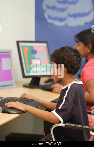 Students using computer in a classroom Stock Photo