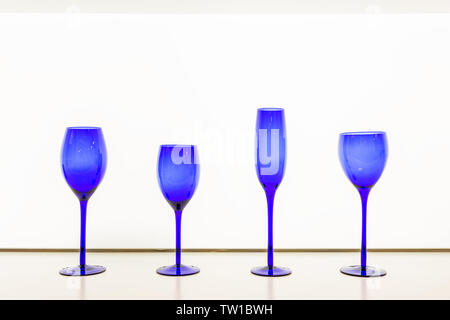 isolated empty blue goblet against white background Stock Photo