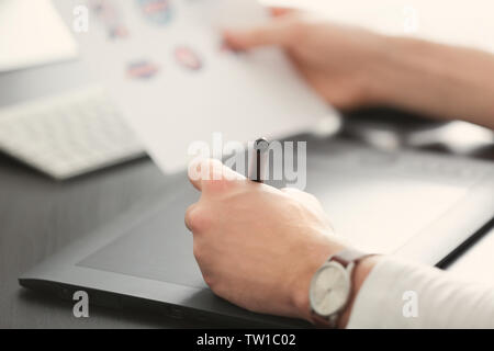 Male hands using graphics tablet Stock Photo