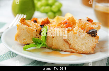 Delicious bread pudding with fruits on plate Stock Photo