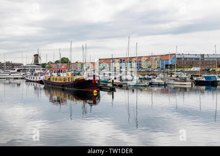 Hellevoetlsuis,15-june-2019:skyline of the old village of Hellevoetlsuis with the windmill and the boats in the harbor, this place was the old entrance to rotterdam Stock Photo