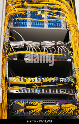 View of open cabinet with wires in server room Stock Photo