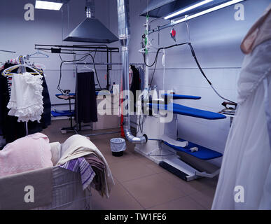 Cleaning service concept. Dry cleaner's workshop Stock Photo