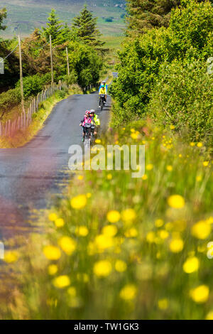 Ardara, County Donegal, Ireland. 18th June 2019. Tourists from Germany enjoy some sunshine between showers on their cycling holiday. Credit: Richard Wayman/Alamy Live News Stock Photo