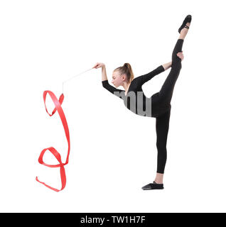 Young girl doing gymnastics with ribbon on white background Stock Photo