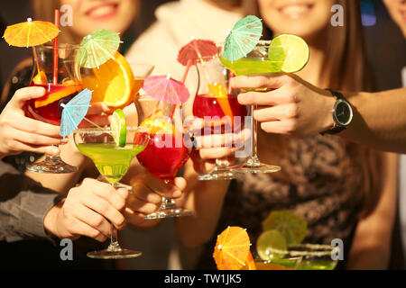 Friends with tasty cocktails at party, closeup Stock Photo