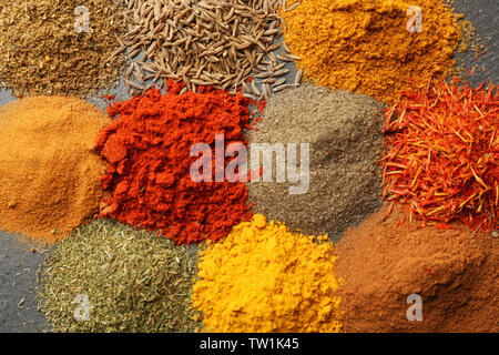 Heaps of various spices on table Stock Photo