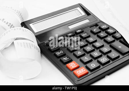 Calculator with adding machine tape, closeup Stock Photo