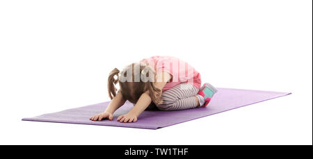Cute girl doing gymnastic exercises on mat, isolated on white Stock Photo