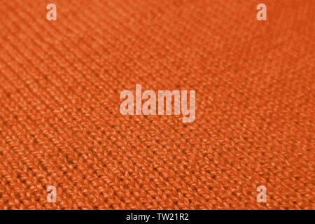 Closeup of Deep Orange Color Colored Alpaca Knitted Wool Fabric in Diagonal Patterns Stock Photo