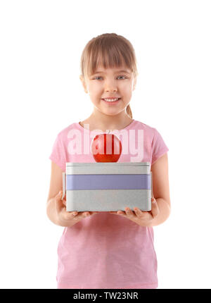 Happy schoolgirl with lunch box and apple on white background Stock Photo
