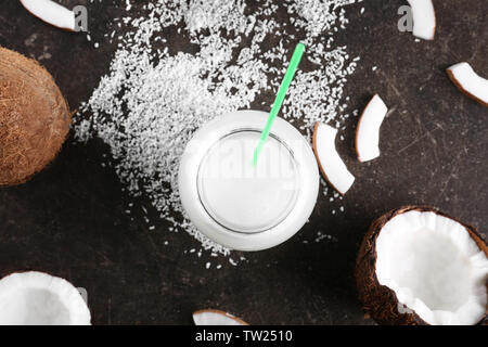 Composition with fresh coconut milk on dark table Stock Photo