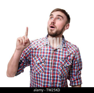 Young man with finger pointing up on white background Stock Photo