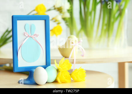 Beautiful composition of Easter symbols on wooden table Stock Photo