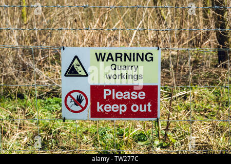 Warning sign of quarry workings Stock Photo