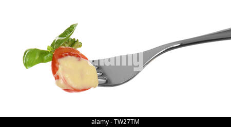 Fork with pinned snack on white background Stock Photo