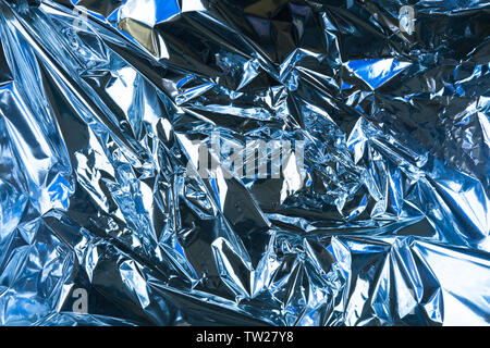 Abstract crumpled foil background. Grunge photo background. Light blue color. Stock Photo