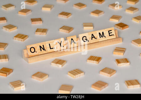 Scrabble Word Game wood tiles spelling 'Only a Game' Stock Photo