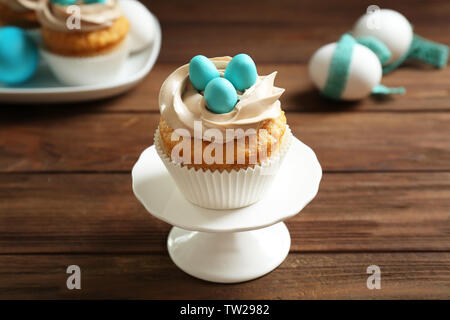 Delicious Easter cupcake on cake stand Stock Photo